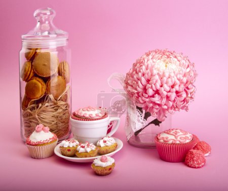 Still life of cupcakes with flower