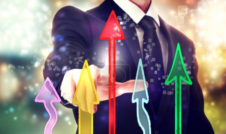 businessman pointing rising arrows
