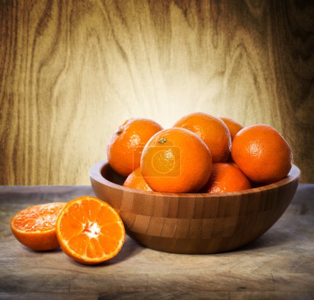Tangerines in wooden bowl