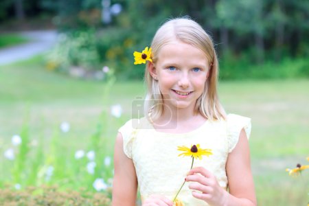 Blond Girl Holding a Flower