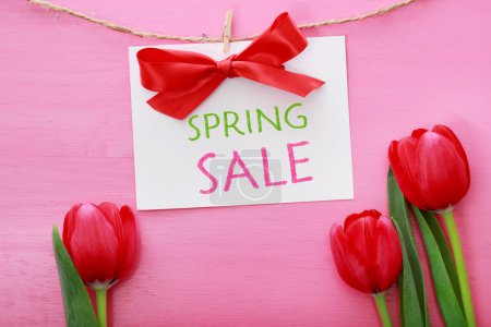 Spring sale sign with red tulips