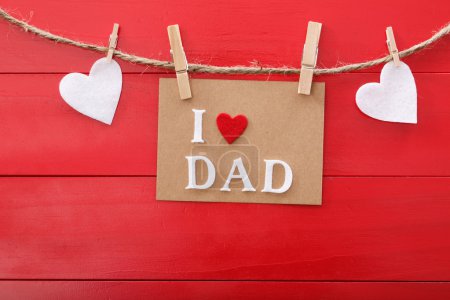 Fathers day message over red wooden board 