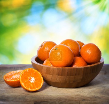 Tangerines in wooden bowl