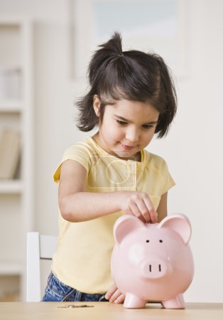 Girl With Piggy Bank