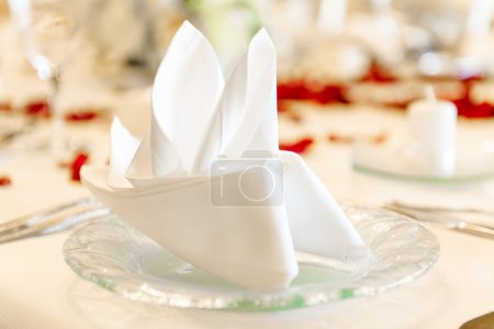 Close-up photo of folded napkin on a table at restaurant