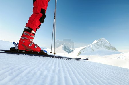 skier on untouched ski track