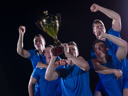 Soccer players celebrating victory