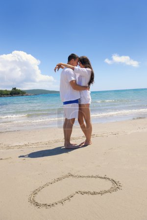 Couple  with heart on sand