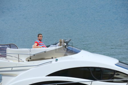 young man on yacht