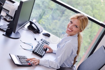 business woman working on her desk in an office