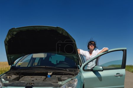 woman with broken car