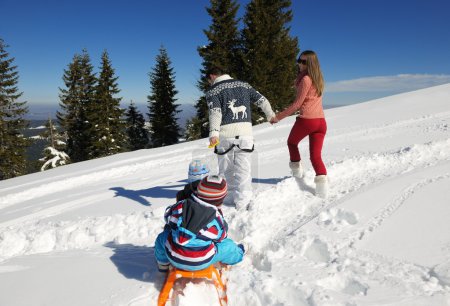 Family having fun on fresh snow
