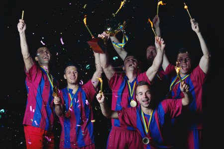 Soccer players celebrating victory
