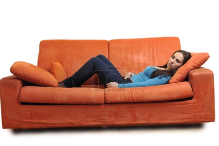 Woman relax on orange sofa