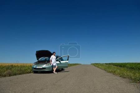 woman with broken car