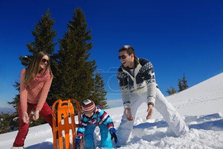 Family playing in snow