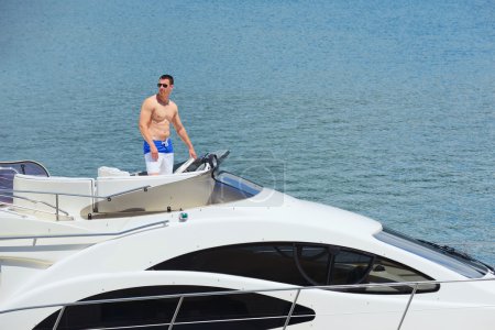 Young man on yacht