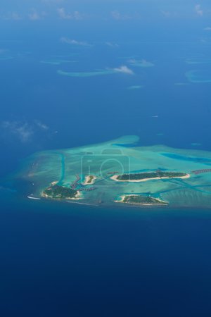 View of tropaical island from helicopter