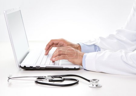 Doctor working on a laptop
