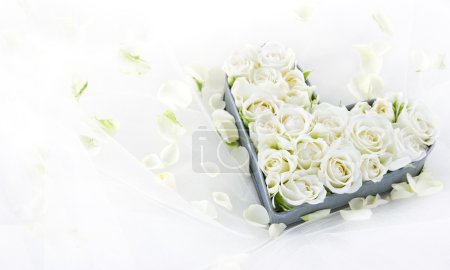 Roses in a heart shaped metal tray