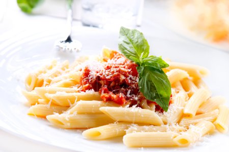 Pasta Penne with Bolognese Sauce, Basil and Parmesan