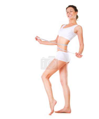 Woman measuring her waistline. Perfect Slim Body