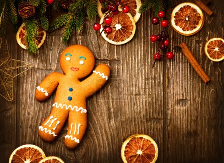 Christmas Holiday Background. Gingerbread Man over Wood