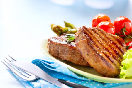 Steak. Grilled Beef Steak Meat with Vegetables