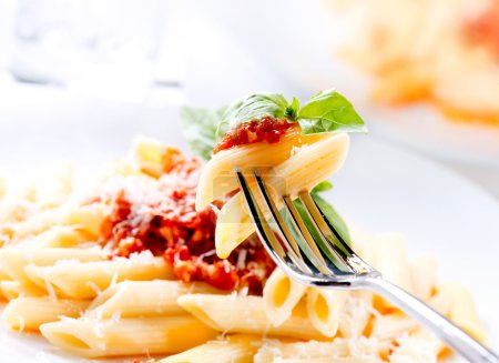 Pasta Penne with Bolognese Sauce, Basil and Parmesan