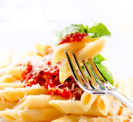 Pasta Penne with Bolognese Sauce, Basil and Parmesan