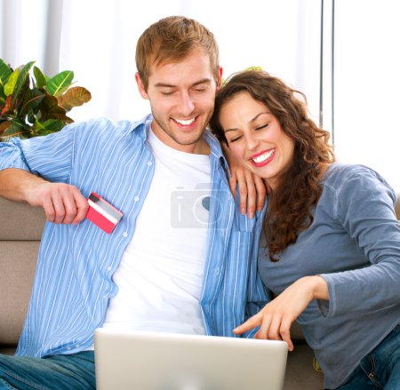Online Shopping. Couple Using Credit Card to Internet Shop