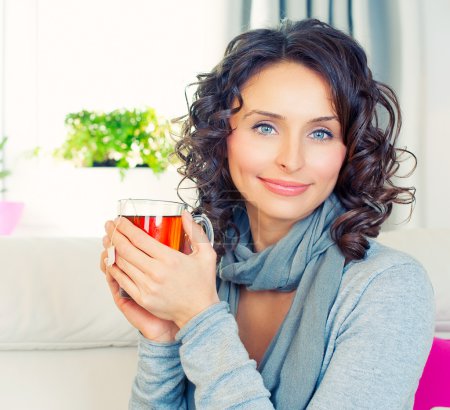 Beautiful Girl Enjoying Coffee. Woman with Cup of Hot Beverage