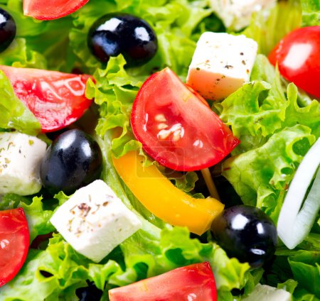Greek Salad closeup with Feta Cheese, Tomatoes and Olives