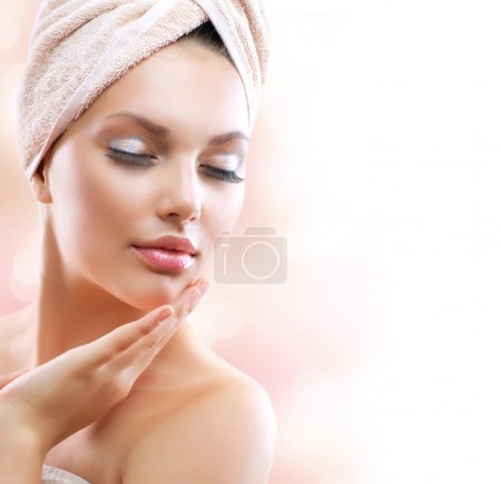 Spa Girl. Beautiful Young Woman After Bath Touching Her Face