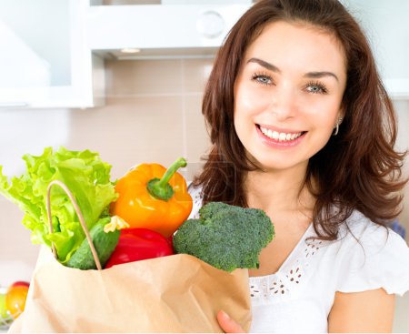 Happy Young Woman with Vegetables in Shopping Bag. Diet Concept 