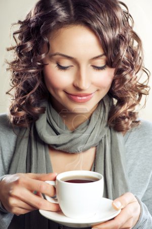Beautiful Woman drinking Coffee or Tea