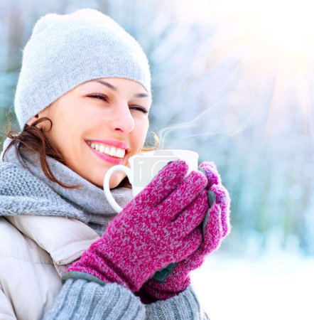Beautiful Happy Smiling Winter Woman with Mug Outdoor