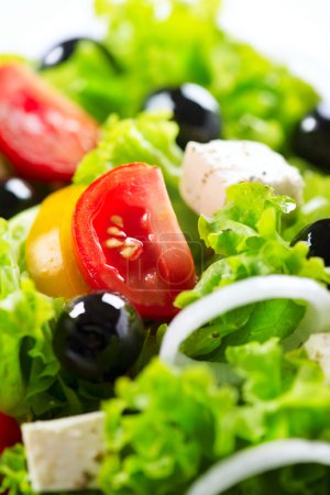 Greek Salad closeup with Feta Cheese, Tomatoes and Olives