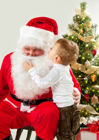 Santa Claus and Little Boy. Christmas Scene