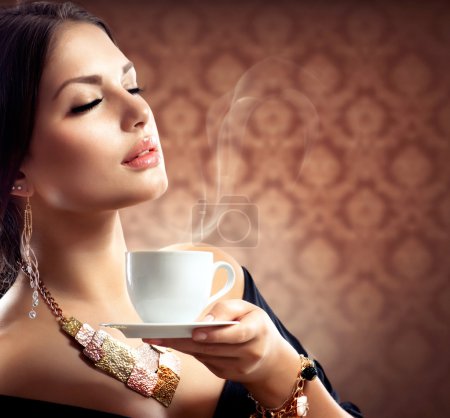 Beautiful Woman With Cup of Coffee or Tea