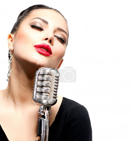 Singing Woman with Retro Microphone isolated on white
