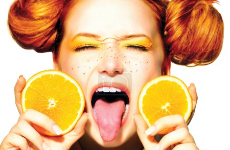 Teen girl with juicy oranges.