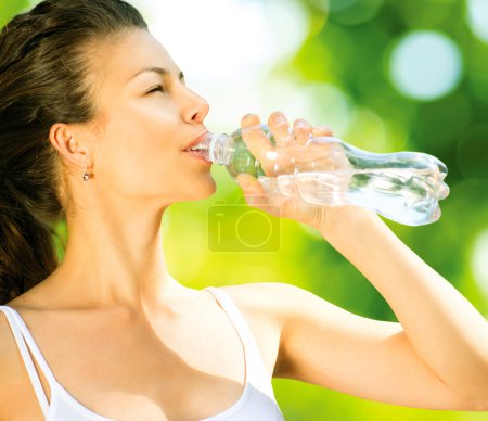 Sporty Young Woman Drinking Water