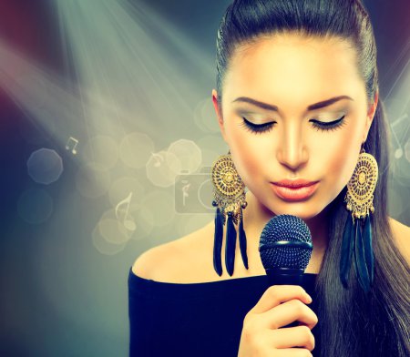 Beautiful Singing Girl. Beauty Woman with Microphone