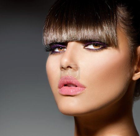 Fringe. Fashion Model Girl With Trendy Hairstyle and Makeup