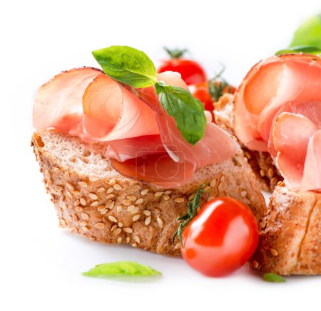 Jamon. Slices of Bread with Spanish Serrano Ham. Prosciutto