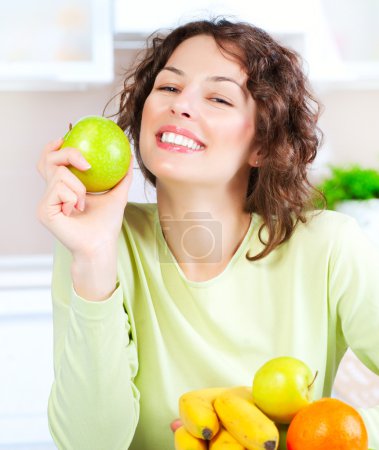 Diet. Happy Young Woman Eating Fresh Fruit