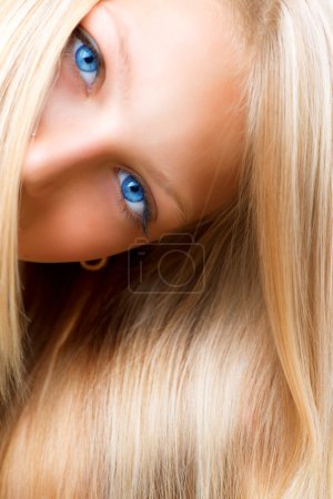 Blond Hair. Blonde Girl with Blue Eyes