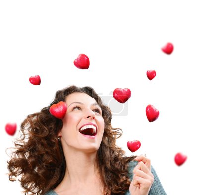 Beauty Young Woman Catching Valentine Hearts. Love Concept