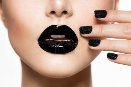 Trendy Black Caviar Manicure and Black Lips. Fashion Makeup
